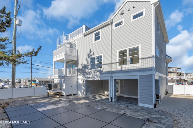 rear view of property featuring a balcony