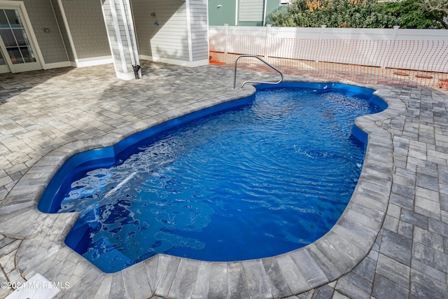 view of pool featuring a patio