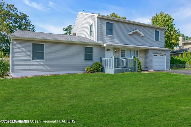 front of property featuring a garage and a front yard