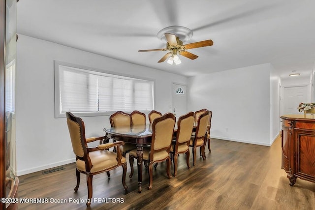 dining area with hardwood / wood-style flooring and ceiling fan