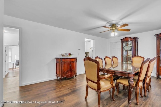 dining space featuring dark hardwood / wood-style floors and ceiling fan