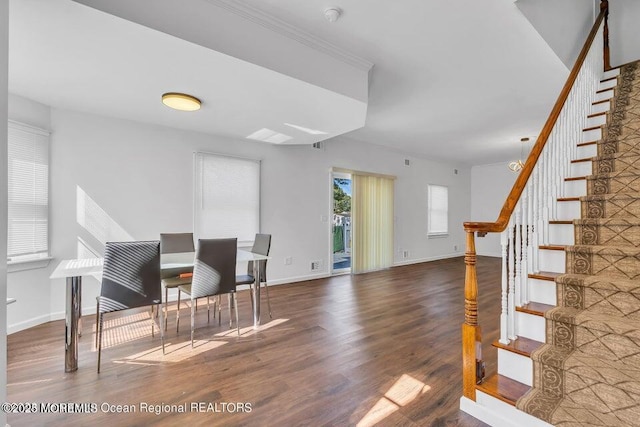 dining space with dark hardwood / wood-style flooring