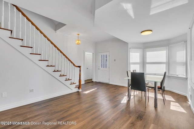 entryway with dark hardwood / wood-style flooring