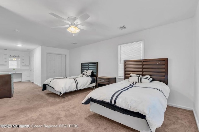 bedroom featuring light carpet, a closet, and ceiling fan