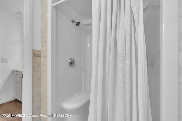 bathroom with a shower with curtain