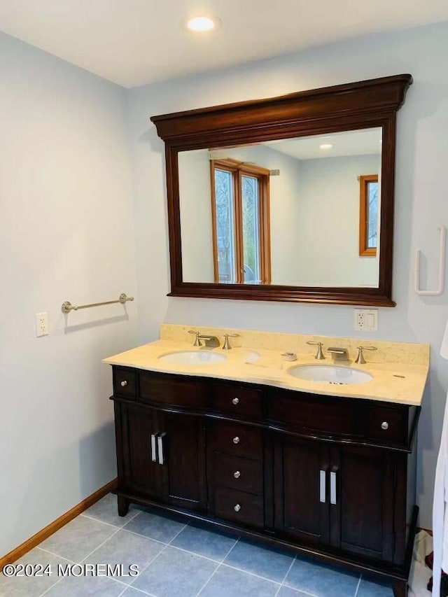 bathroom featuring vanity and tile patterned flooring