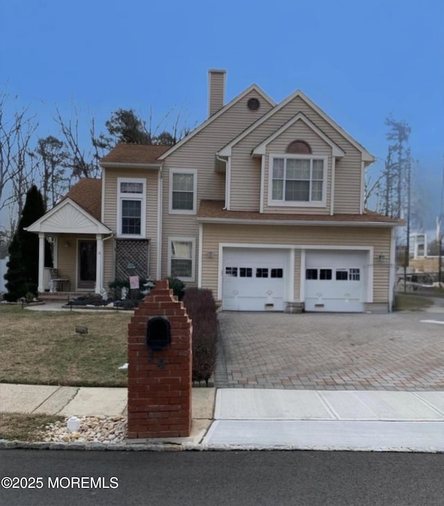 front of property with a garage