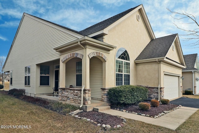 view of front facade featuring a porch and a garage