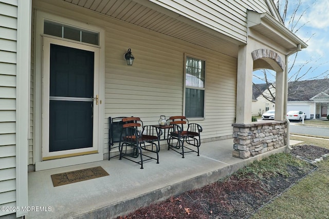 property entrance with covered porch