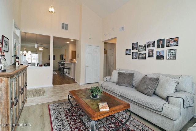 living room featuring hardwood / wood-style flooring and ceiling fan