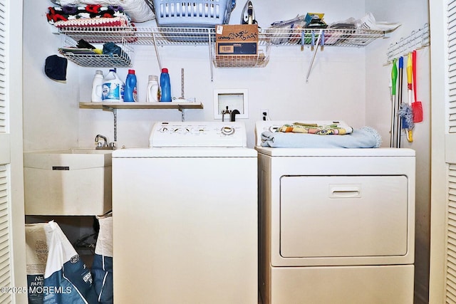 laundry room featuring sink and washer and dryer