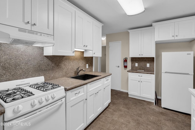 kitchen with tasteful backsplash, white appliances, sink, and white cabinets