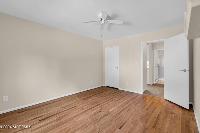 unfurnished bedroom with ceiling fan and light hardwood / wood-style floors