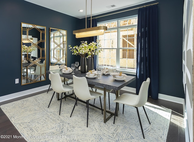 dining room with hardwood / wood-style flooring