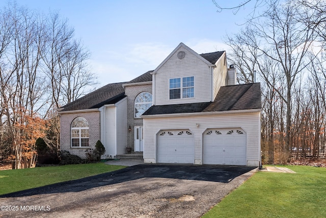 front facade featuring a garage and a front yard