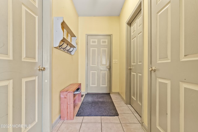 entryway featuring light tile patterned floors