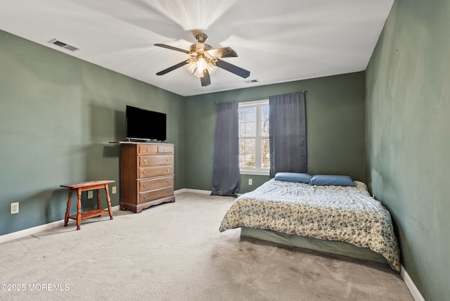 bedroom featuring light carpet and ceiling fan