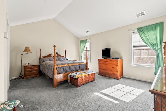 bedroom with lofted ceiling and light colored carpet