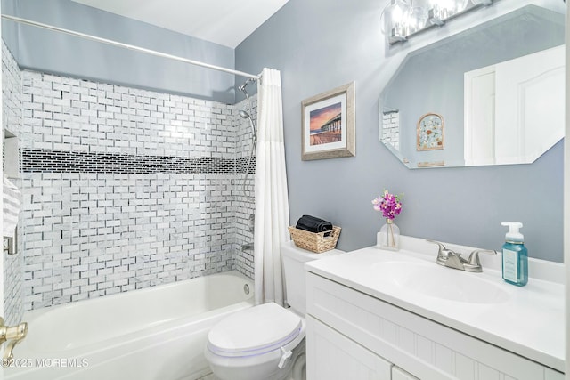 full bathroom featuring shower / bathtub combination with curtain, vanity, and toilet