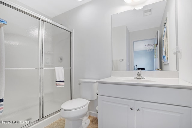 bathroom with vanity, toilet, and walk in shower