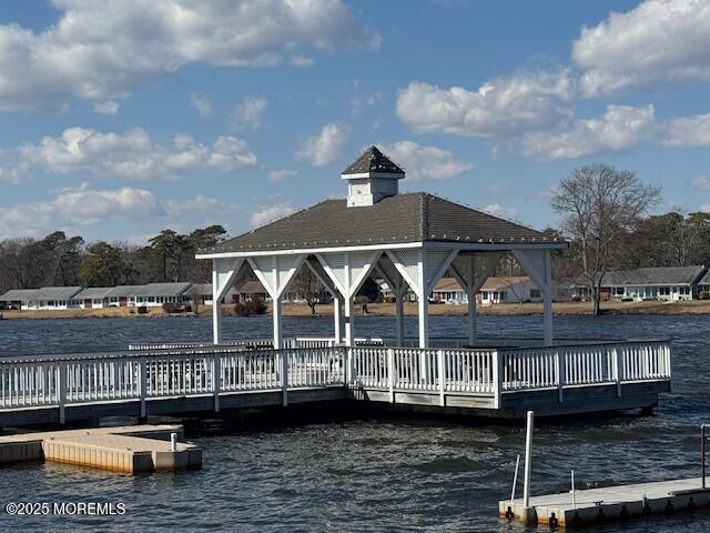 dock area featuring a water view and a gazebo