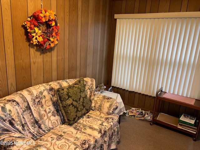 interior space with carpet flooring and wood walls