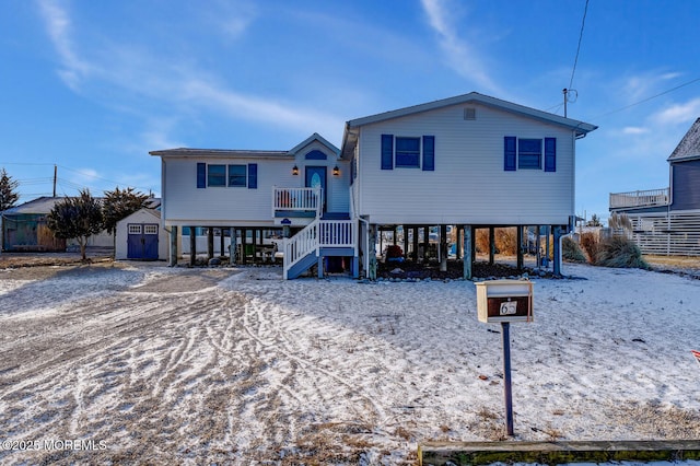 view of front of home with a storage shed