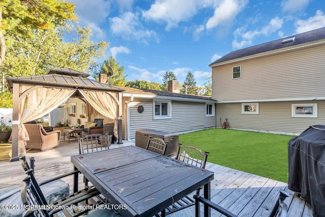 wooden terrace with area for grilling, a yard, a gazebo, and outdoor lounge area