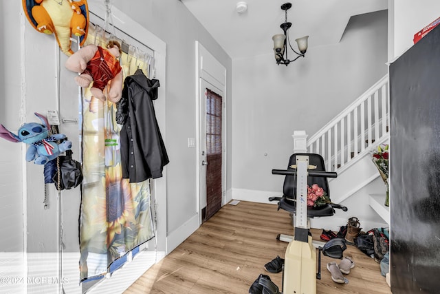 interior space featuring a notable chandelier and light hardwood / wood-style flooring