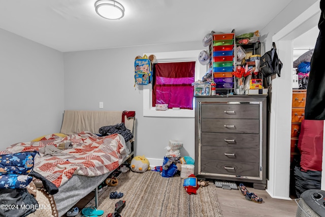 bedroom featuring hardwood / wood-style floors