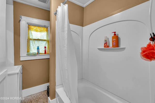 bathroom featuring vanity and shower / bath combo with shower curtain