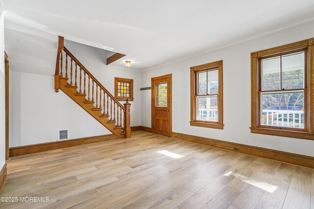 entrance foyer with light hardwood / wood-style flooring