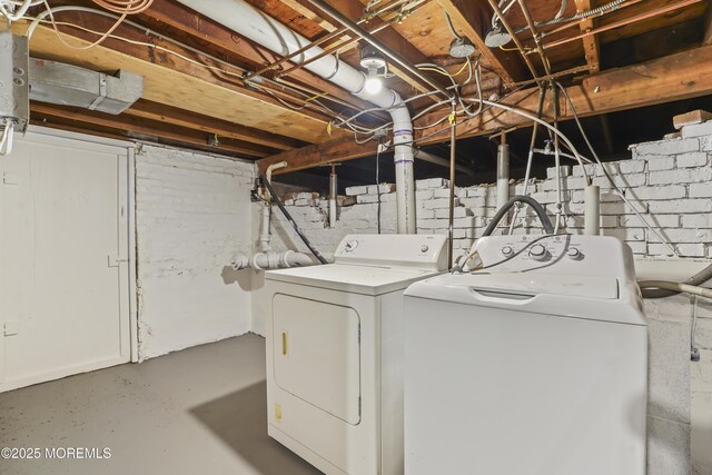 laundry area with washing machine and dryer