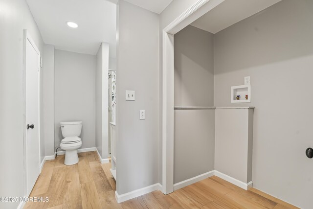 bathroom featuring toilet and hardwood / wood-style floors