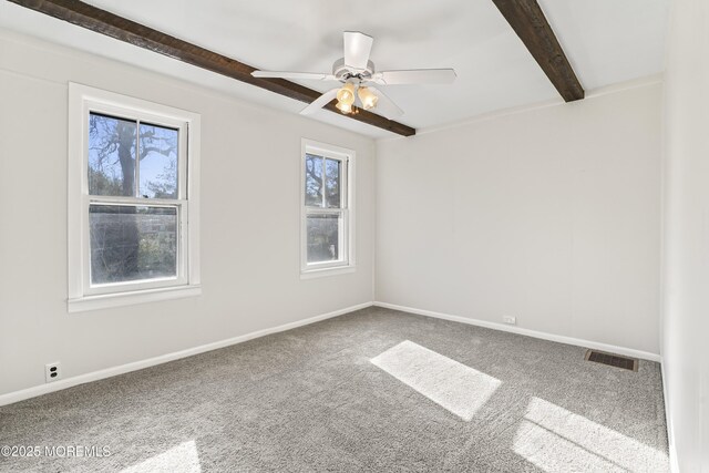 carpeted spare room with beam ceiling and ceiling fan