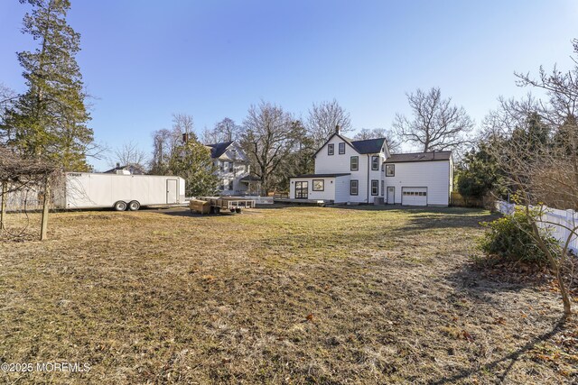 view of yard with a garage