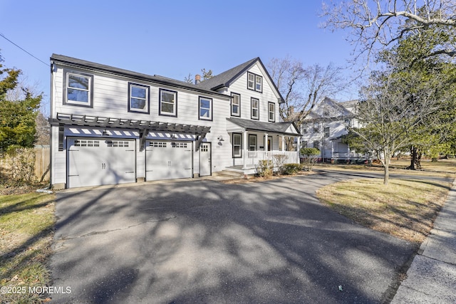 view of front of house with a garage and a porch