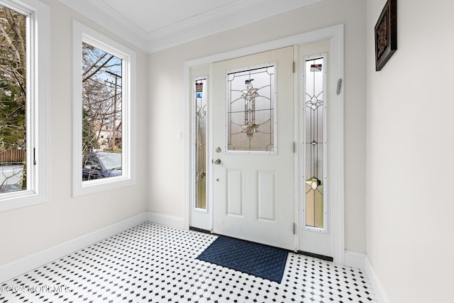 foyer featuring crown molding