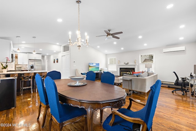 dining room featuring ceiling fan, lofted ceiling, hardwood / wood-style floors, and a wall unit AC