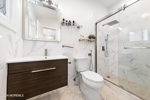 bathroom with vanity, tile walls, toilet, and walk in shower