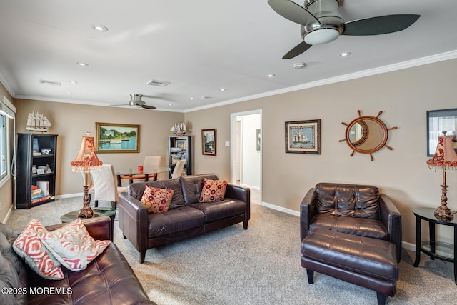 carpeted living room with crown molding and ceiling fan