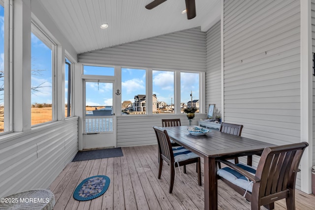 sunroom with lofted ceiling and ceiling fan