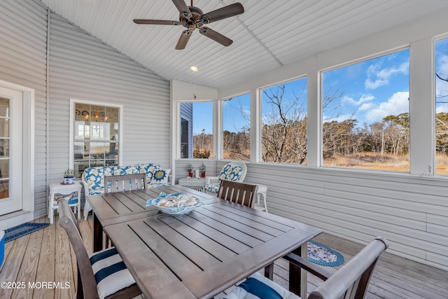 sunroom featuring lofted ceiling and ceiling fan