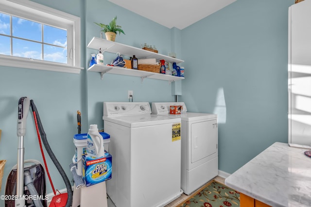 clothes washing area with independent washer and dryer