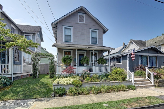 view of front facade with a porch and a front yard