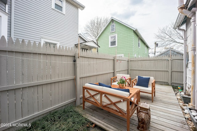 wooden deck featuring an outdoor living space