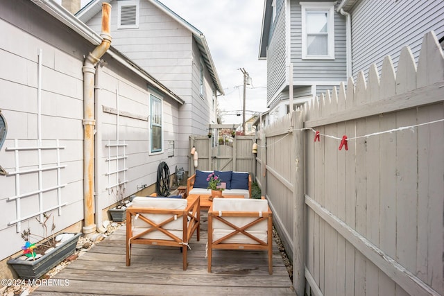 deck featuring outdoor lounge area