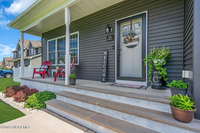 doorway to property featuring covered porch