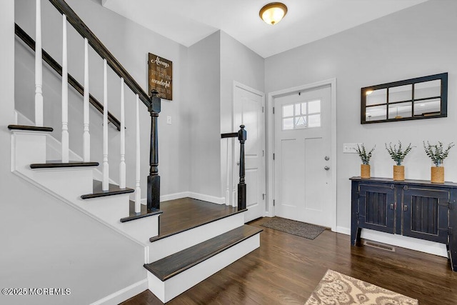 foyer featuring dark hardwood / wood-style floors