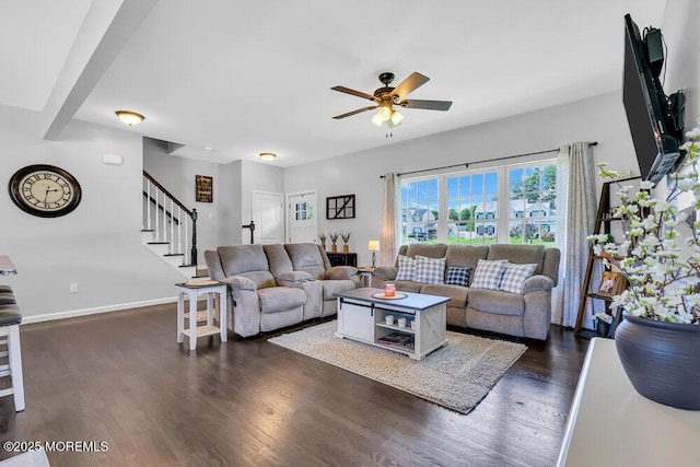 living room with dark wood-type flooring and ceiling fan